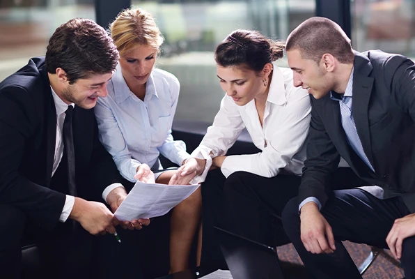 Business group reviewing papers