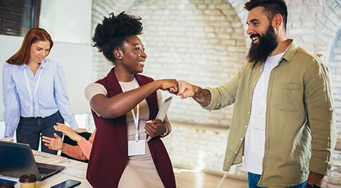 energetic-leadership Colleague fist bump