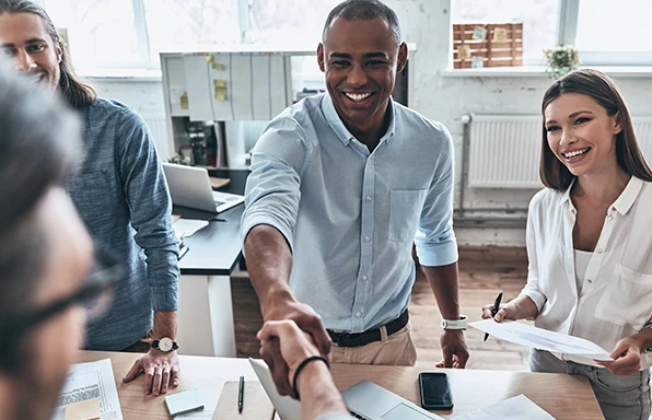 leading-with-humility Employees shaking hands
